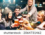 Small photo of Happy people drinking beer at brewery bar out doors - Multicultural life style concept with genuine friends enjoying time together at open air restaurant patio - Vivid filter with focus on guy