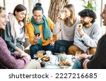 Small photo of Trendy friends watching menu on mobile phone at coffee bar - Young people having fun together at cafeteria on brunch time - Life style concept with happy men and women at cafe venue - Bright filter