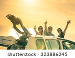 Best friends having fun and cheering by car road trip at sunset - Group of happy people outdoor on vacation tour - Friendship and youth concept at travel together with positive nostalgic emotions