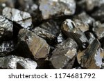 Black coal mine close-up with soft focus. Anthracite coal bar on dark background
