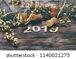 Happy New Year 2019. Symbol from number 2019 on wooden background. 