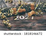 Happy New Year. Symbol from number 2021 on wooden background