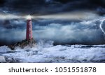 Lighthouse in stormy landscape  ...