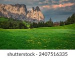 Small photo of Picturesque alpine place with yellow dandelion flowers on the green fields. Spectacular cliffs and flowery meadows at sunrise, Alpe di Siusi, Dolomites, Italy, Europe