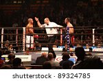 Small photo of FLORENCE, ITALY - NOV 4: Judge warns "Leonard Bundu" [Boxer-L] while keeping "Danile Petrucci" [Boxer-R] by one arm at "European Welter Boxing Title" in Florence, Italy on Nov 4, 2011.