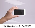 Holding smartphone in hand