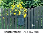 A Mailbox On A Wooden Fence And ...