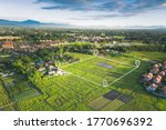 Small photo of Land plot in aerial view. Include landscape, real estate, green field, agricultural plant, pin location icon. For housing subdivision, residential, development, owned, sale, rent, buy or investment.