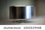 Small photo of levitating neodymium magnet. A levitating magnet over a superconductor filled with liquid nitrogen