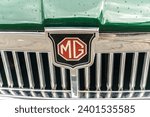 Small photo of WETTENBERG, HESSE, GERMANY - 07 - 28 - 2023: Logo frombritish MG retro Car at a traditional Car Show Golden Oldies. MG was a British car brand owned by the MG Rover Group until 2005