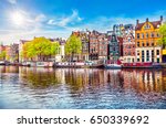 stock-photo-amsterdam-netherlands-dancing-houses-over-river-amstel-landmark-in-old-european-city-spring-650339692.jpg