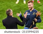 Small photo of LVIV, UKRAINE - October 12, 2021: Andrei Pyatov and Andrei Yarmolenko received a mace and a T-shirt with a mark of one hundred games, Ukraine