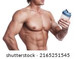 Muscular bodybuilder with a shaker full of whey protein on white background