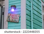 Small photo of NEW ORLEANS, LA - OCTOBER 13, 2022: "Floozies and Hussies Use Side Entrance" sign on front of Uptown home on October 13, 2022 in New Orleans, LA, USA