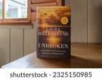 Small photo of NEW ORLEANS, LA, USA - JUNE 16, 2023: Closeup of #1 New York Times bestselling book, "Unbroken," by Laura Hillenbrand on a Tabletop