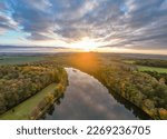 Water reflection at sunset time. Evening autumn landscape. Czech Republic. Aerial view from drone.