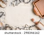 Christmas baking background with flour, rolling pin, cookie cutter and  rustic bake pan, top view, place for text. Horizontal