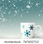 white mug with blue snowflakes... | Shutterstock . vector #767652712