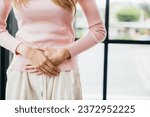 Small photo of Sad Woman Stomach Ache from menstruation. young female unhappy unwell sick ill hand holding on stomach suffers pain at home, Abdomen bloating and Chronic gastritis concept