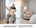 Small photo of Happy curator person doctor pushing and walk elderly patient freedom raising arm at hospital, Asian senior retired old man sitting on wheelchair having fun with young woman nurse, disabled sanatorium