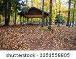 Autumn At Michigan State Parks. Picnic shelter surrounded by vibrant fall foliage on a warm autumn day at Twin Lakes State Park in the Upper Peninsula of Michigan.