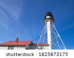 Small photo of Whitefish Point lighthouse stands guard on the isolated Lake Superior shoreline. This shoreline is notoriously dangerous and due to so many shipwrecks is referred to as the Graveyard Coast.
