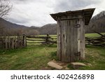 Wooden Outhouse In The Smoky...