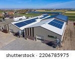 Small photo of Drone photo of modern solar panels on a commercial building. Solar panels provide cheap solar energy.