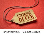 exclusive offer-  sign a paper price tag against textured red paper, shopping and marketing concept