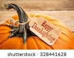 pumpkin with a Happy Thanksgiving paper price tag -  holiday shopping concept