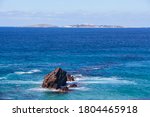 A beautiful afternoon on Glasshouse Rocks Beach with view of Montague Island near Narooma, NSW, Australia