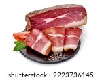 Small photo of Italian prosciutto crudo or spanish jamon. Jerked meat, isolated on white background. High resolution image