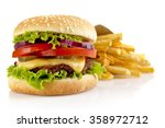 Big single cheeseburger with french fries isolated on white background