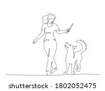 woman training dog with stick....