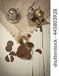 Small photo of Traditional Ramadan Bayram desserts madlen chocolate with concept white wooden background.