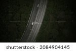 Small photo of Aerial view of unmanned Aerial Vehicle UAV or reconnaissance drone monitoring highway traffic tracking and targeting suspect moving vehicle