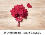Knitted Love hearts on a wooden background, valentines day post card concept