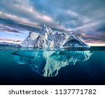 Iceberg With Above And...