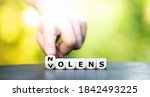 Small photo of Dice form the latin expression "nolens volens" (willing or unwilling).