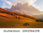 Beautiful autumn colors at the foot of the Odle Mountains in the backdrop of the Seceda Mountains in the Dolomites, Trentino Alto Adige, Val di Funes Valley, South Tyrol in Italy