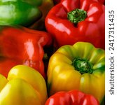 Small photo of Colorful bell peppers.Close up of assorted red and yellow bell peppers(bell pepper,capcicum). Also known as Sweet pepper, Pepper or Capsicum.top view