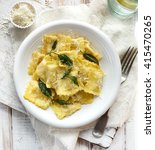 Small photo of Ravioli with sage butter sprinkled with grana padano cheese