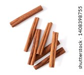 Small photo of Cinnamon sticks isolated on white background closeup. Canella spice. Aromatic condiment background. Flat lay, top view.