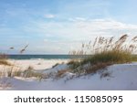 Sand dunes and ocean at sunset, Pensacola, Florida.