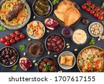 Ramadan kareem Iftar party table with assorted festive traditional Arab dishes, sweets, dates. Eid al-Fitr mubarak evening grand meal, top view. Islamic holidays food concept, Ramadan feast 