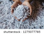 hand showing heap of shredded paper. Concept of recycle and office work of confidential