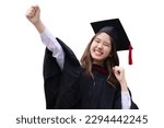Small photo of College degree graduations. Happy young Asian girl in gown with mortarboard isolated on white background.