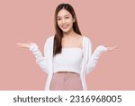Small photo of Beauty Asian woman making open palm for show something isolated on pink background.