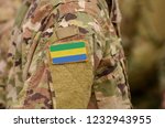 Small photo of Gabonese Republic flag on soldiers arm. Gabon troops (collage)