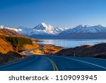 Scenic winding road along Lake Pukaki to Mount Cook National Park, South Island, New Zealand during cold and windy winter morning. One of the most beautiful viewing point of Aoraki Mount Cook.